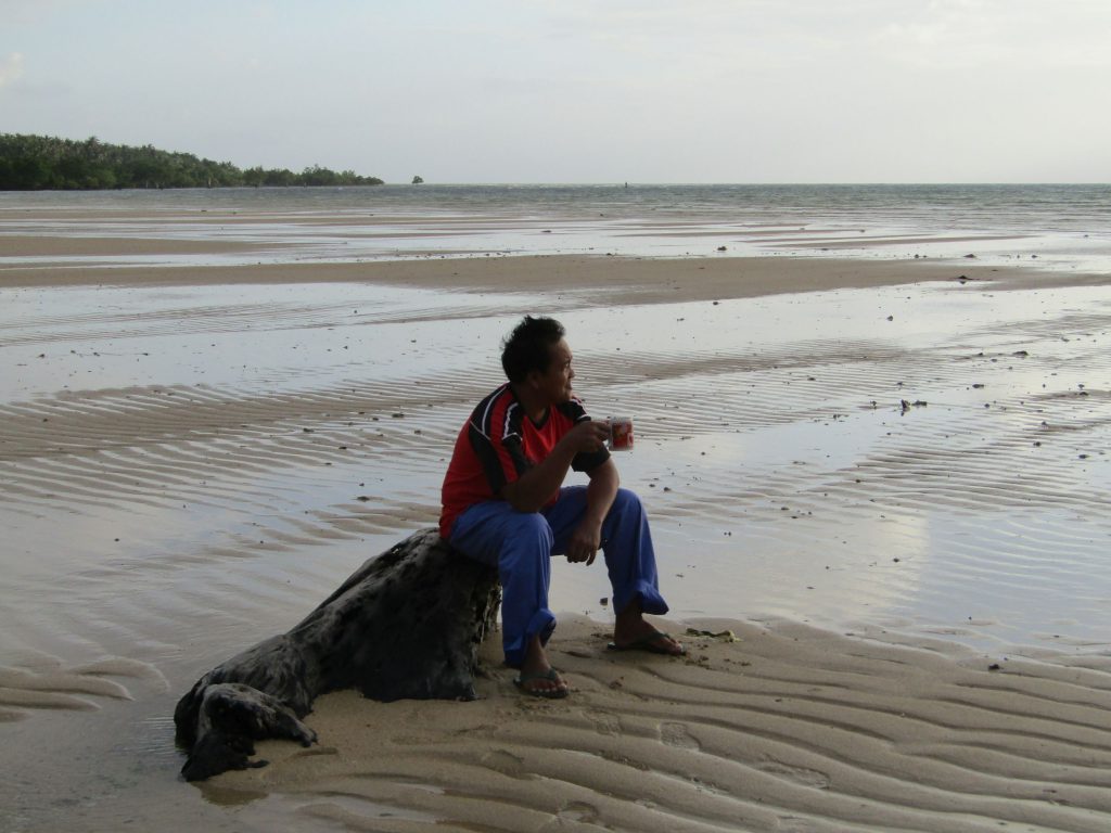 Lelen enjoys his morning coffee amidst the beauty of Cagbalate Island