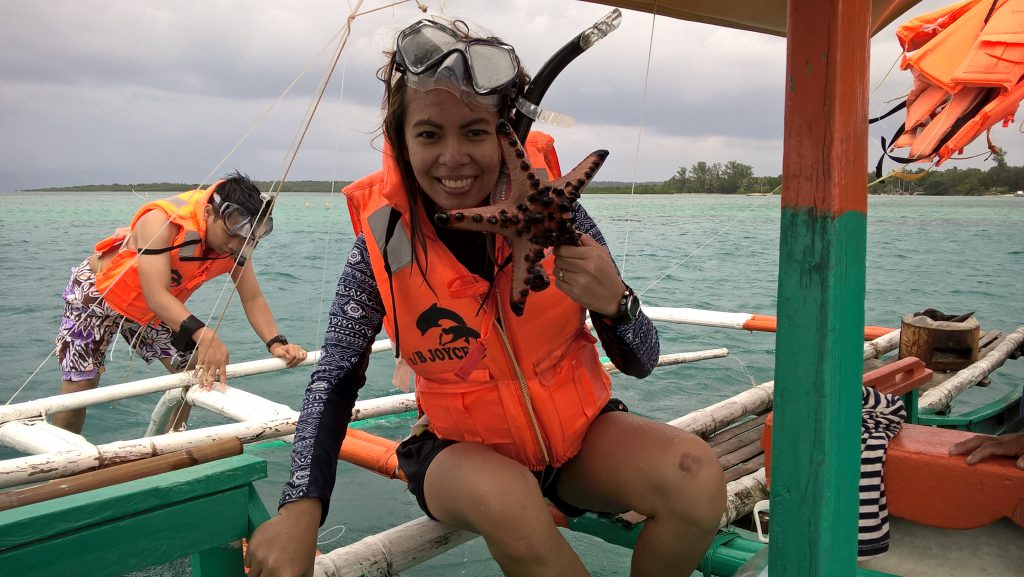 Johan and a colorful starfish -- Cagbalate Island