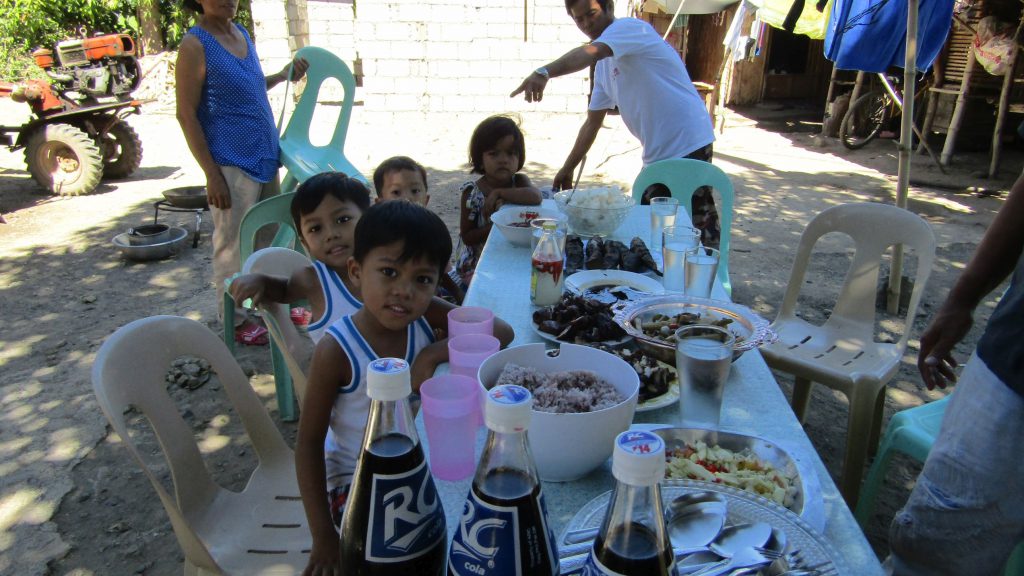 The kids can't wait to lay their hands on the food!