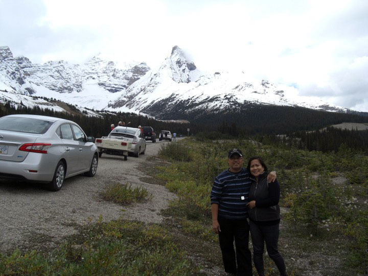 A short photo break to take in all the natural beauty ---on the road going to Jasper (Alberta, Canada) Taking a short photo break before entering Jasper. It's almost the end of summer but the peaks are already ice-laden.