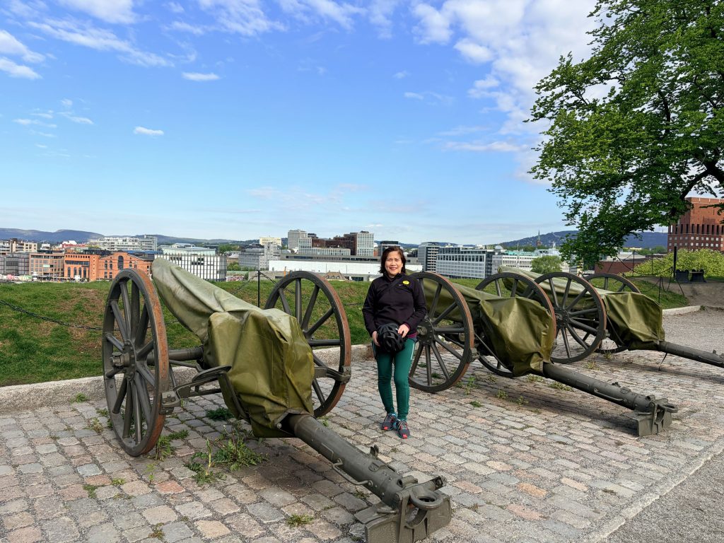 With a short climb up a steep embankment inside the Akershus Fortress, one can catch a glimpse of the castle and a panoramic view of Oslo's skyline and marina. 